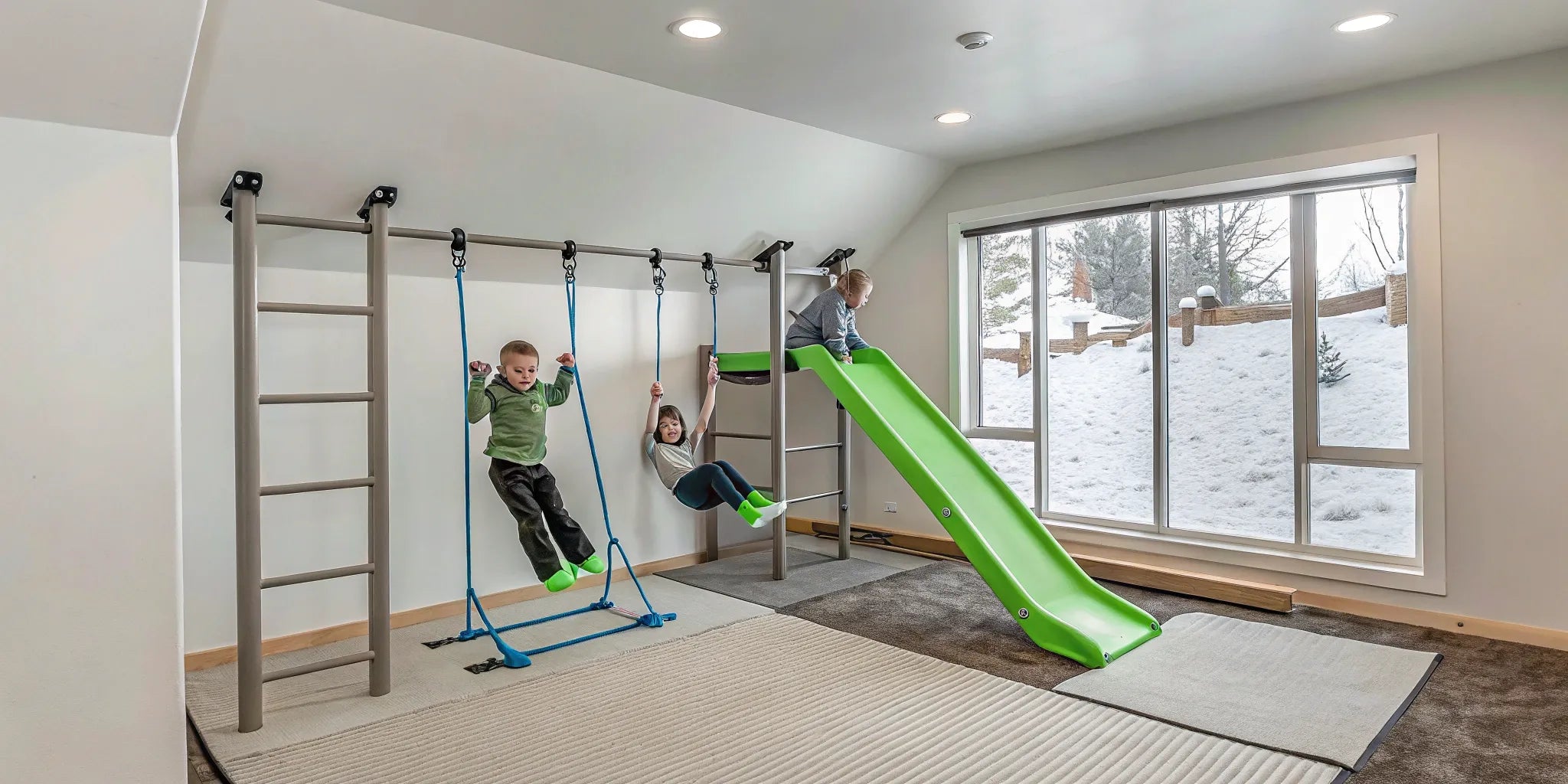 Indoor home play gym with swings and slide.
